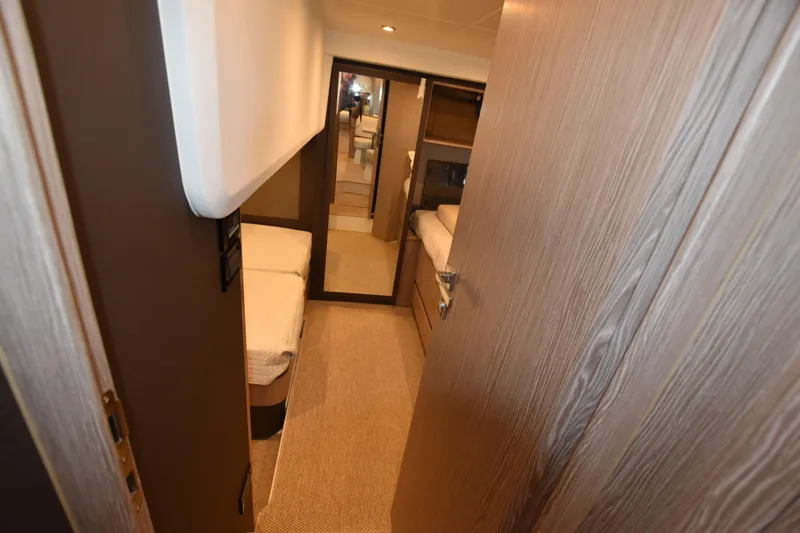 Vasanti Ll Yacht Photos Pics Spacious Interior cabin of 2023 Azimut Atlantis 45 motor boat, featuring modern design and cozy beds.