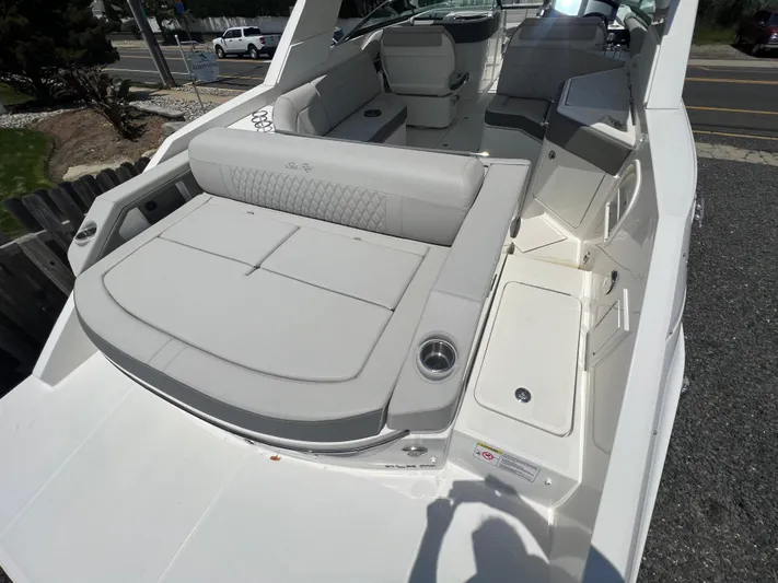  Yacht Photos Pics 2022 Sea Ray SLX 310 boat with spacious seating and modern design.