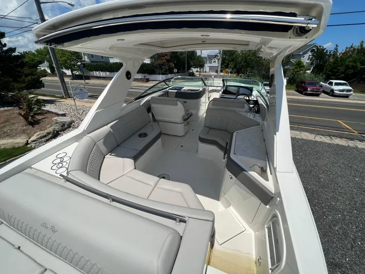  Yacht Photos Pics 2022 Sea Ray SLX 310 boat interior with spacious seating and modern design.