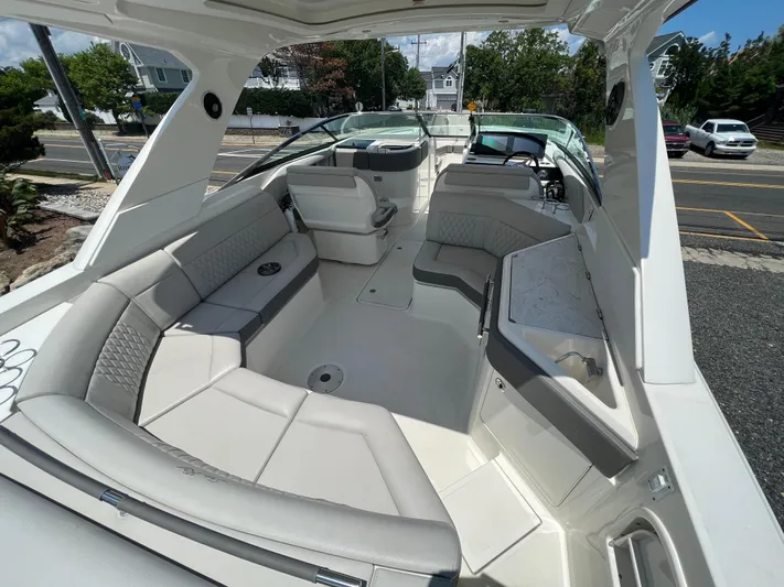  Yacht Photos Pics 2022 Sea Ray SLX 310 boat interior with spacious seating and modern design.