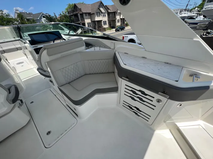  Yacht Photos Pics Luxurious interior of 2022 Sea Ray SLX 310 boat with elegant seating and modern design.
