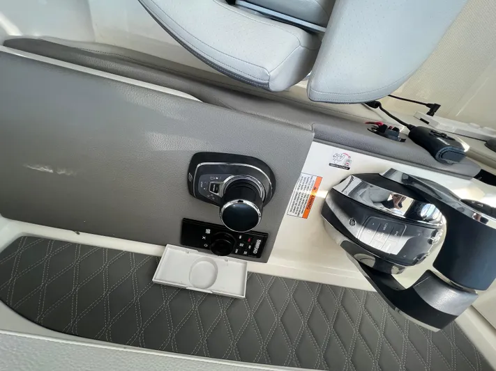  Yacht Photos Pics 2022 Sea Ray SLX 310 boat control panel with joystick and steering wheel.