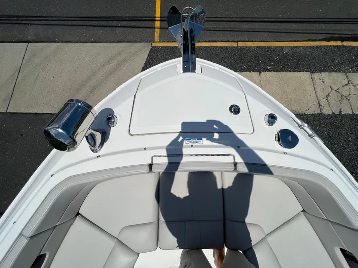 Yacht Photos Pics Bow of 2022 Sea Ray SLX 310 boat with seating and anchor.