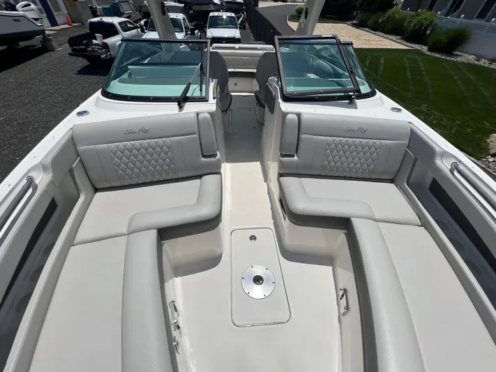  Yacht Photos Pics 2022 Sea Ray SLX 310 boat interior with luxurious seating and open deck.