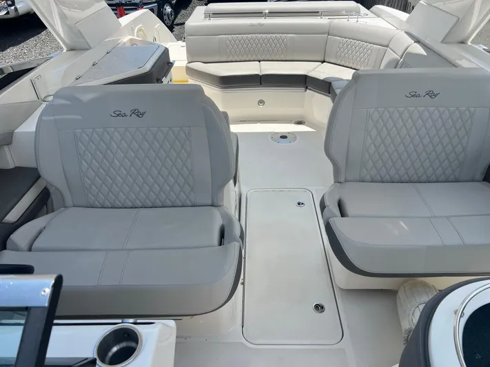  Yacht Photos Pics Luxurious interior of 2022 Sea Ray SLX 310 boat with plush seating.