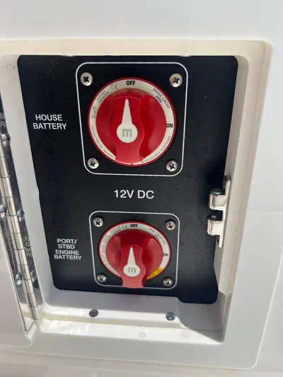  Yacht Photos Pics Battery control panel on a 2022 Sea Ray SLX 310 boat, featuring 12V DC switches.