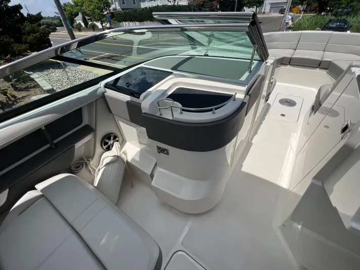  Yacht Photos Pics 2022 Sea Ray SLX 310 boat interior with sleek seating and modern dashboard.