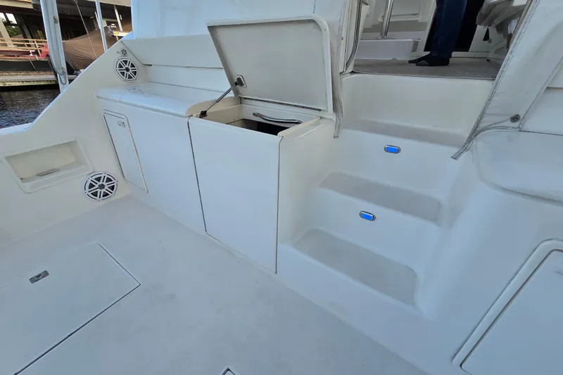  Yacht Photos Pics 1999 Ocean Yachts 40 Open boat interior with storage compartments and steps.