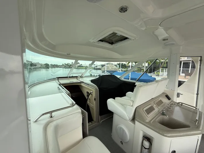  Yacht Photos Pics 2006 Sea Ray 40 Motor Yacht interior with helm, seating, and waterfront view.