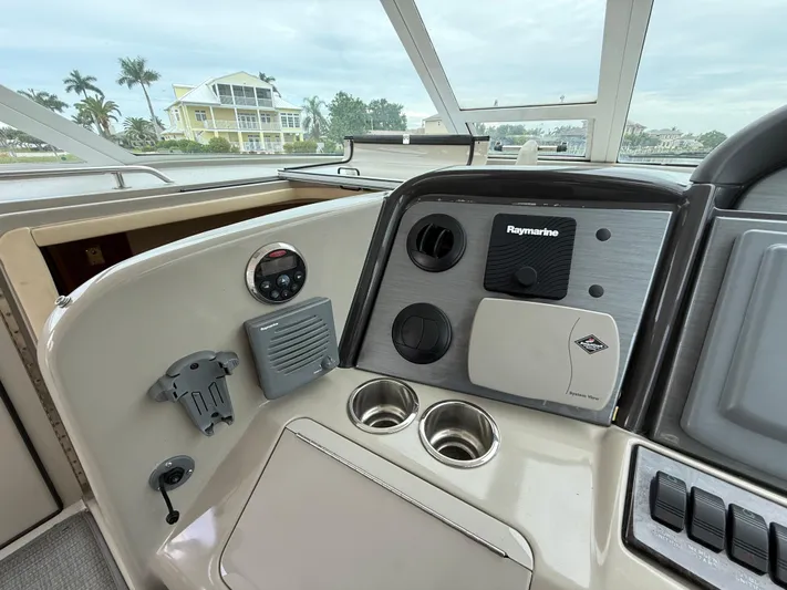  Yacht Photos Pics 2006 Sea Ray 40 Motor Yacht helm with Raymarine navigation system and waterfront view.