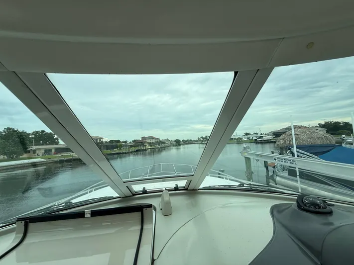  Yacht Photos Pics View from 2006 Sea Ray 40 Motor Yacht cockpit, overlooking a serene waterfront neighborhood.