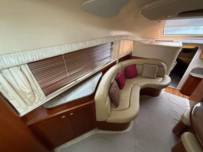  Yacht Photos Pics Luxurious interior of 2006 Sea Ray 40 Motor Yacht with curved seating and elegant decor.