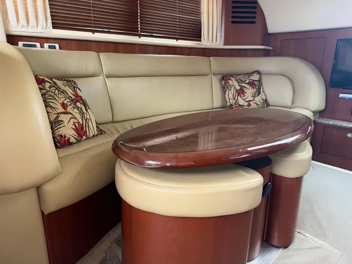  Yacht Photos Pics Luxurious interior of 2006 Sea Ray 40 Motor Yacht with leather seating and wooden table.