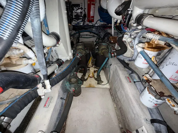  Yacht Photos Pics Engine room of a 2006 Sea Ray 40 Motor Yacht, showing hoses and mechanical components.
