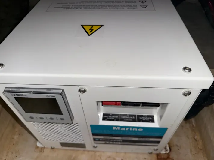  Yacht Photos Pics Electrical panel on a 2006 Sea Ray 40 Motor Yacht, featuring control switches and warning label.