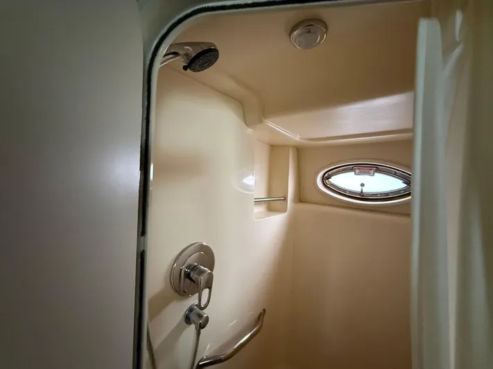  Yacht Photos Pics Shower area in 2006 Sea Ray 40 Motor Yacht with oval window and chrome fixtures.