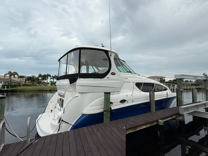  Yacht Photos Pics 2006 Sea Ray 40 Motor Yacht docked at marina under cloudy sky.
