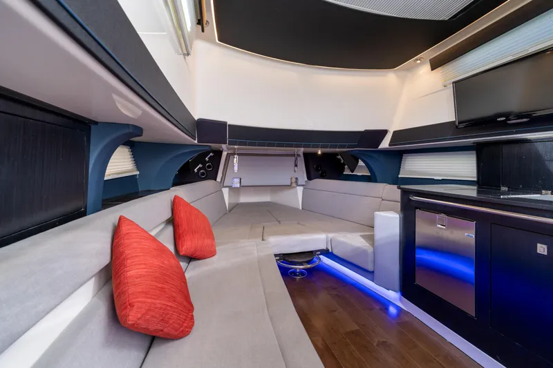 Fast Kash Yacht Photos Pics Luxurious interior of 2023 Boston Whaler 420 Outrage with modern seating and ambient lighting.