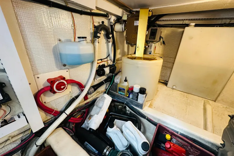 No Rush Yacht Photos Pics Engine room of 2006 Sabre 42 Fly Bridge with maintenance supplies and equipment.