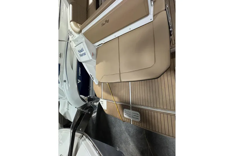  Yacht Photos Pics 2021 Sea Ray Sundancer 320 boat interior with tan seating and wood flooring.