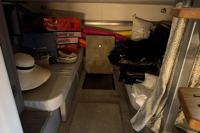  Yacht Photos Pics Interior cabin of 2021 Sea Ray Sundancer 320 with life jackets and accessories.