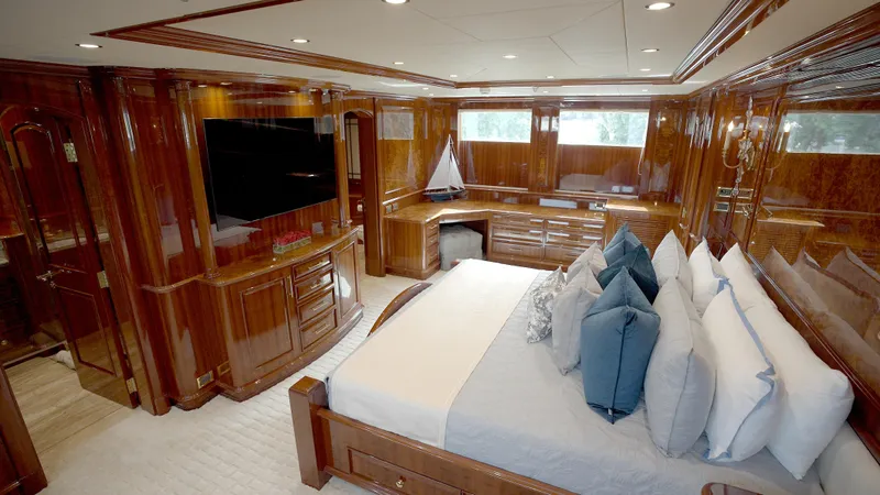 Homecoming Yacht Photos Pics Luxurious 2010 Horizon 136 Premier yacht bedroom with elegant wood paneling and plush bedding.
