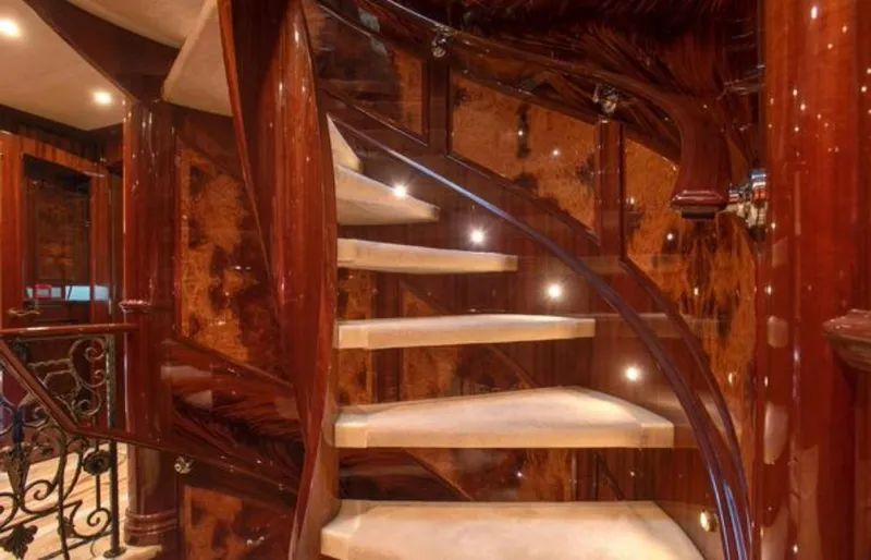 Homecoming Yacht Photos Pics Luxurious spiral staircase with wooden finish on Horizon 136 Premier yacht, 2010 model.