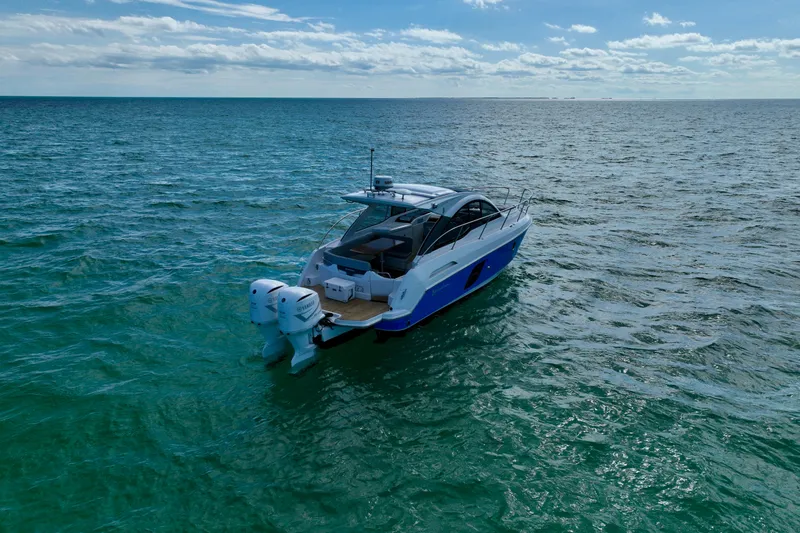  Yacht Photos Pics 2012 Beneteau Gran Turismo 34 yacht cruising on open sea under clear skies.