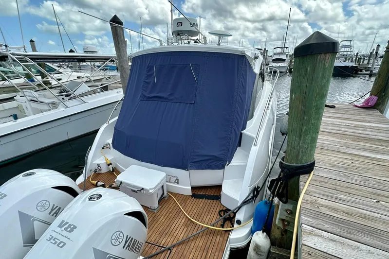  Yacht Photos Pics 2012 Beneteau Gran Turismo 34 docked, featuring Yamaha V8 350 engines and blue cover.