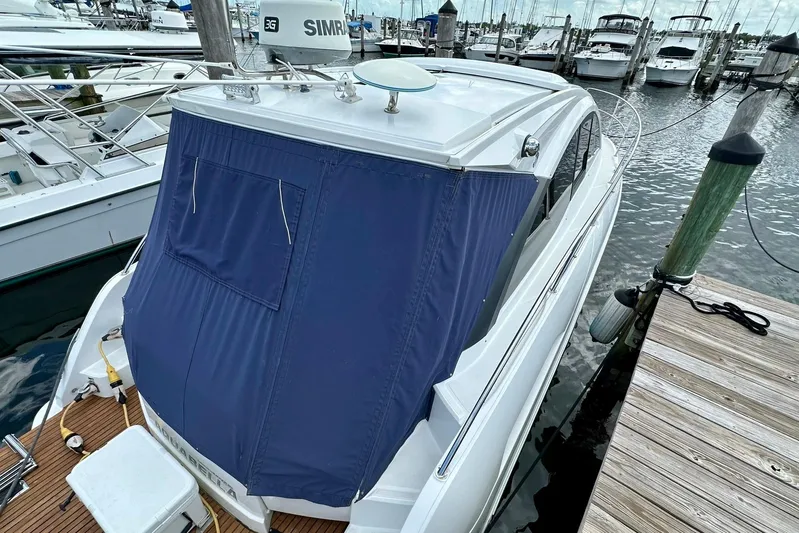  Yacht Photos Pics 2012 Beneteau Gran Turismo 34 yacht docked with blue cover, marina background.