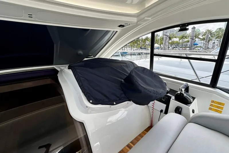 Yacht Photos Pics Interior view of 2012 Beneteau Gran Turismo 34 yacht cockpit with covered steering wheel.