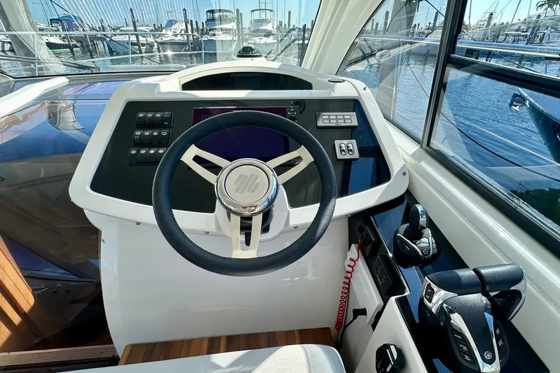  Yacht Photos Pics Helm of 2012 Beneteau Gran Turismo 34 yacht with steering wheel and controls.