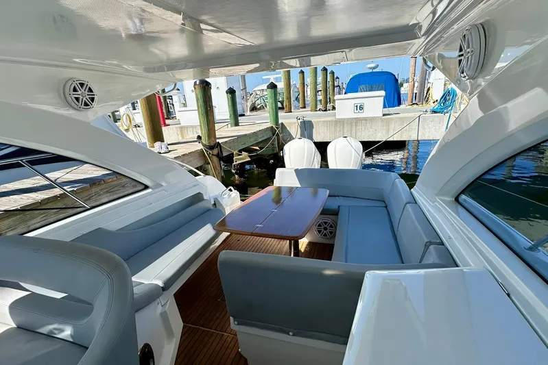  Yacht Photos Pics Luxurious 2012 Beneteau Gran Turismo 34 yacht interior with seating and table at marina.