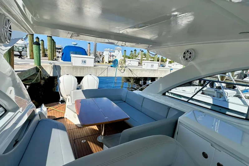  Yacht Photos Pics 2012 Beneteau Gran Turismo 34 yacht interior with seating and table at marina.