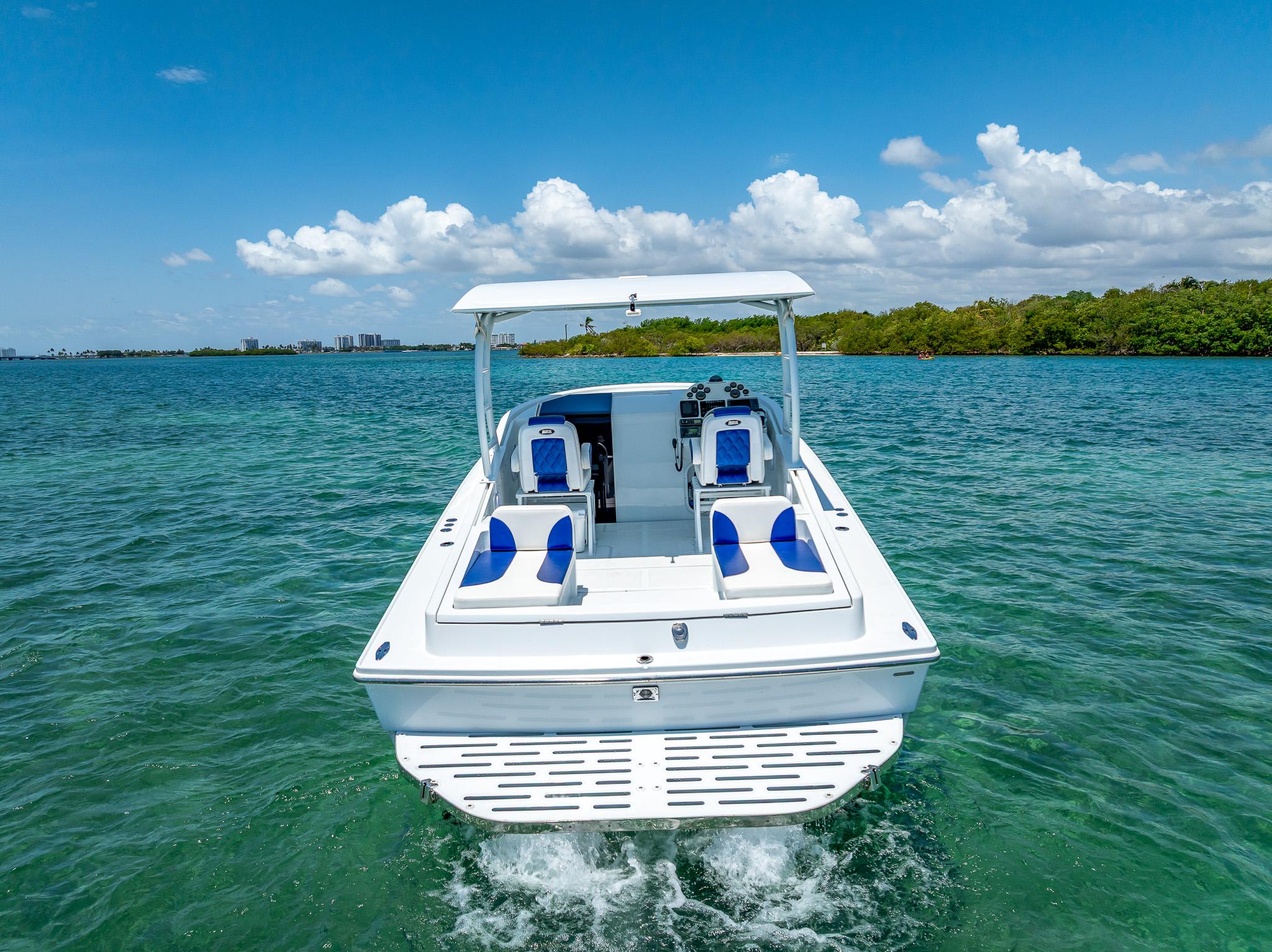 Nova 39 Sport 2020 boat cruising on clear blue water under a sunny sky.