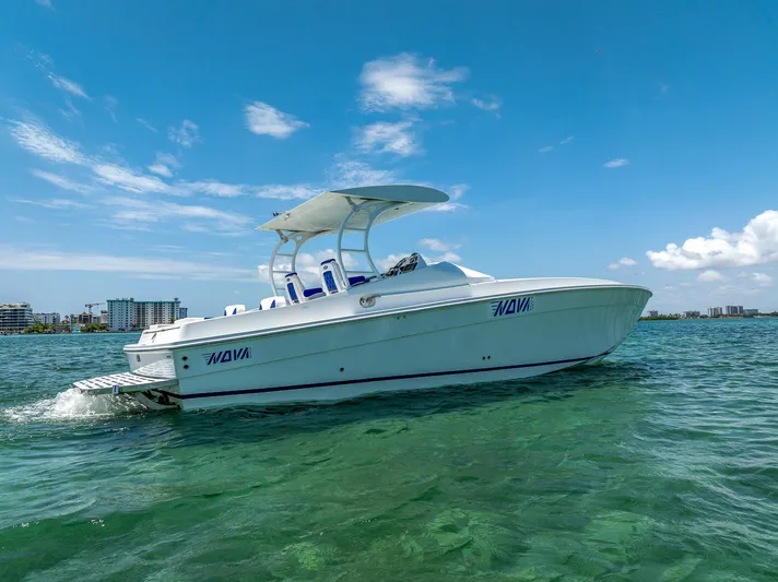  Yacht Photos Pics 2020 Nova 39 Sport boat cruising on clear blue water under a sunny sky.