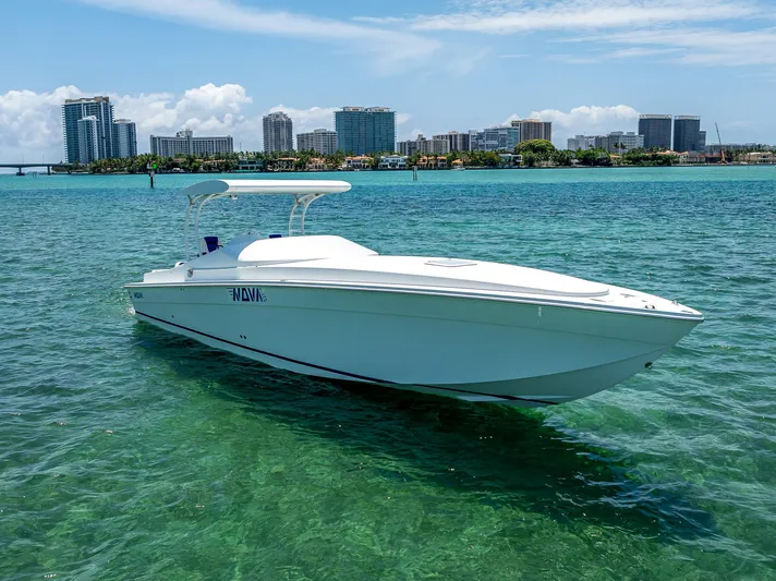  Yacht Photos Pics 2020 Nova 39 Sport boat on clear water with city skyline in background.