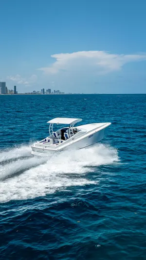  Yacht Photos Pics Nova 39 Sport boat cruising on blue ocean near city skyline, 2020 model.