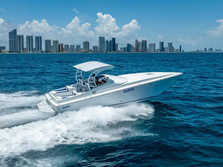  Yacht Photos Pics Nova 39 Sport 2020 speedboat cruising on ocean with city skyline in background.