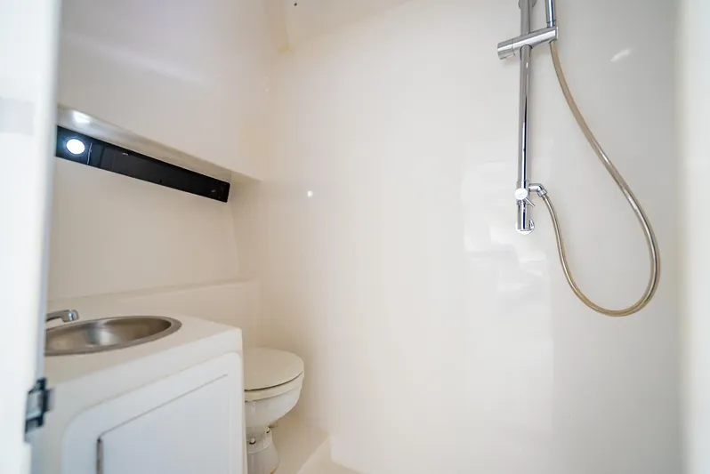  Yacht Photos Pics Compact bathroom in 2020 Nova 39 Sport boat with shower and sink.