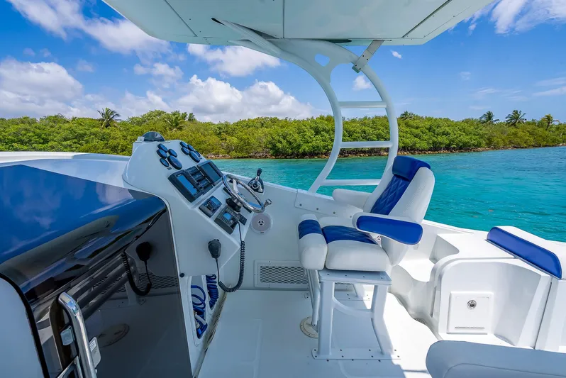  Yacht Photos Pics Cockpit of 2020 Nova 39 Sport boat with blue seating and control panel.