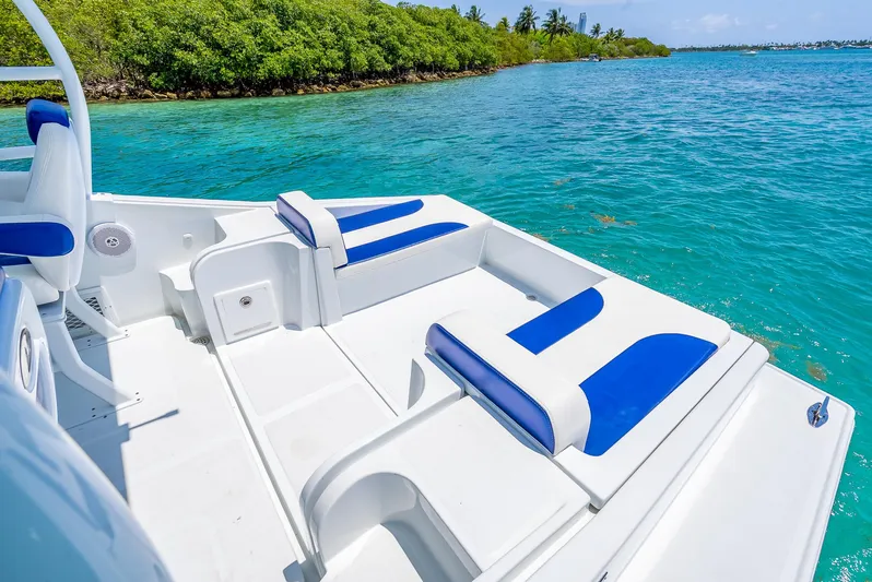  Yacht Photos Pics Nova 39 Sport 2020 boat with blue and white seating on clear turquoise water.