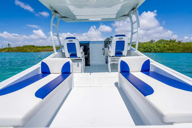 Yacht Photos Pics 2020 Nova 39 Sport boat with blue and white seating on clear water.