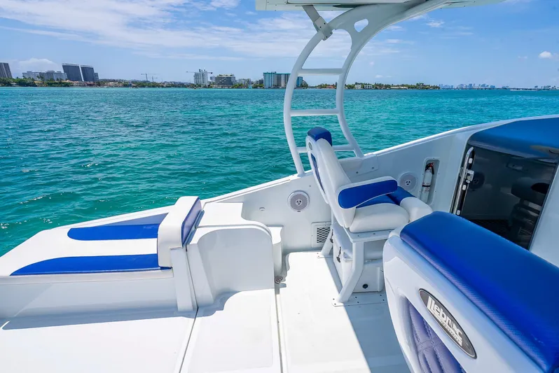  Yacht Photos Pics Nova 39 Sport 2020 boat with blue and white seating on clear ocean water.