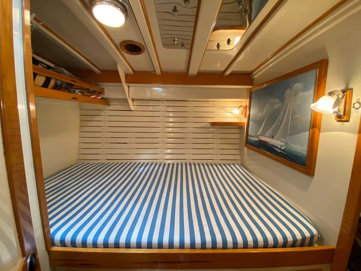 Windigo Yacht Photos Pics Hinckley 1956 ocean racer cabin with striped bedding and nautical decor.