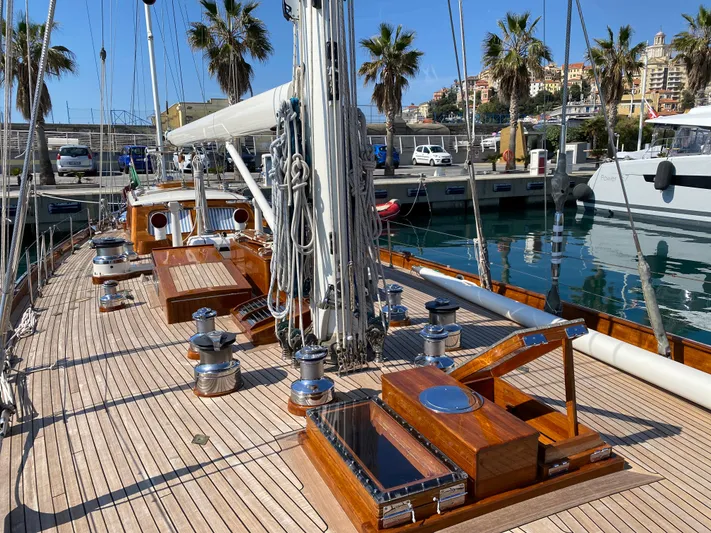 Windigo Yacht Photos Pics 1956 Hinckley ocean racer sailboat with wooden deck, docked in a sunny marina.