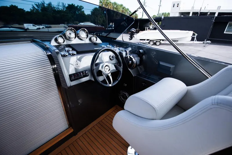  Yacht Photos Pics 2020 Frauscher 1017 GT boat cockpit with modern steering wheel and dashboard.