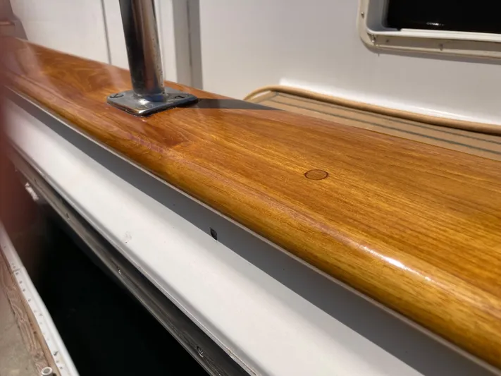  Yacht Photos Pics Polished wooden railing on 1985 Offshore Yachts 48 Yachtfisher.