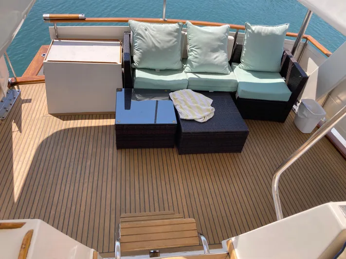  Yacht Photos Pics 1985 Offshore Yachts 48 Yachtfisher deck with seating and ocean view.