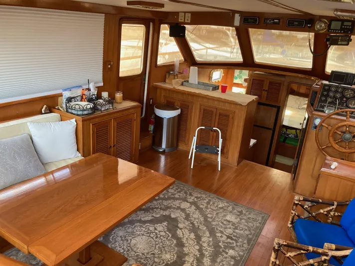  Yacht Photos Pics Interior of 1985 Offshore Yachts 48 Yachtfisher, featuring wood finishes and nautical decor.